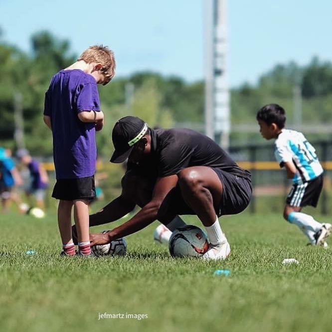Coach with young player